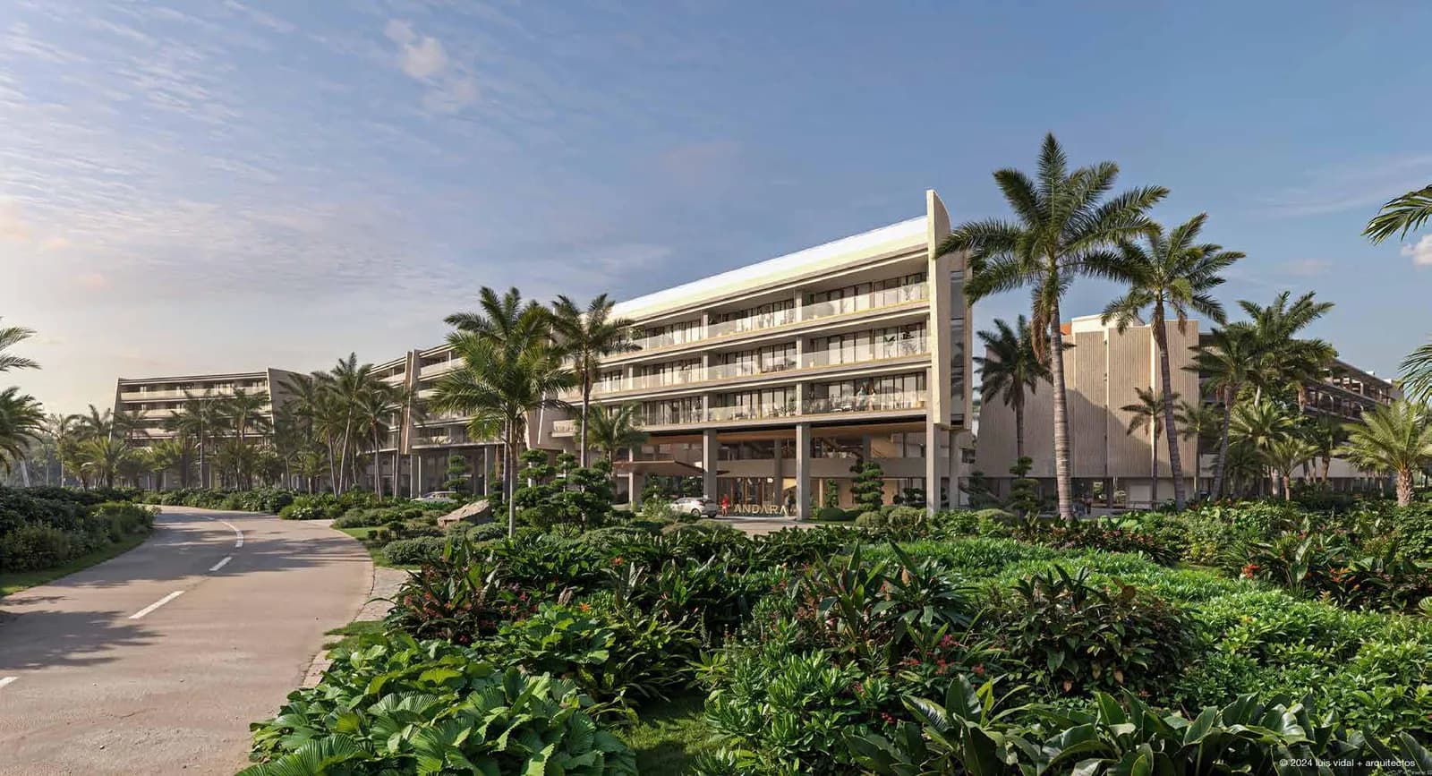Façade d'ANDARA entourée de palmiers et de jardins tropicaux à Cap Cana