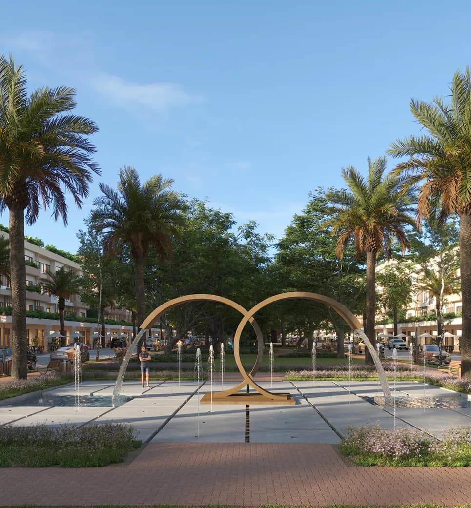 Fontaine interactive et sculpture à anneaux dans le parc central de City Place Punta Cana
