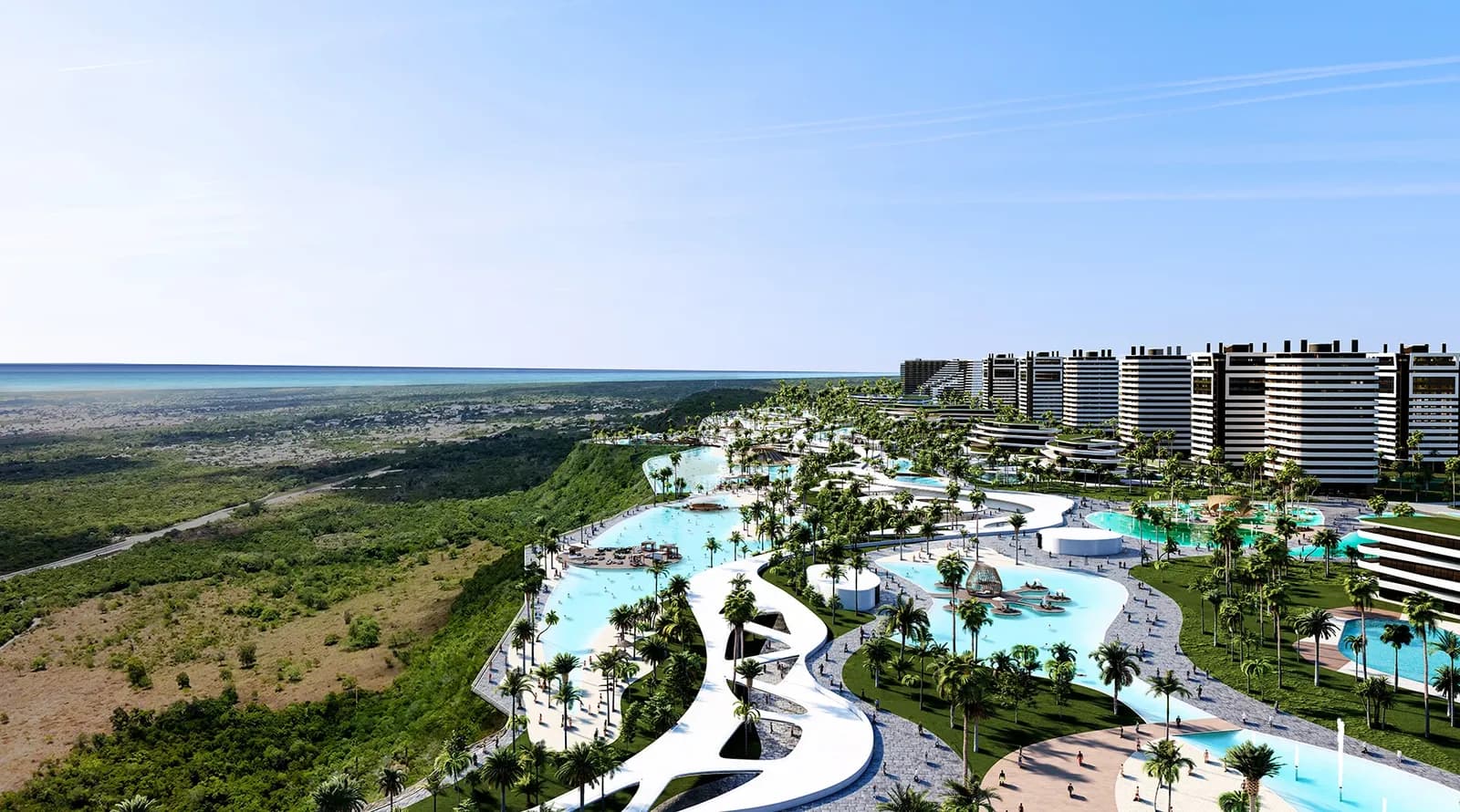 Aerial view of the lagoons and towers of Larimar City & Resort facing the sea